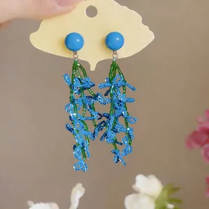 Fresh summer blue beaded tassel earrings featuring green leaf accents on floral design