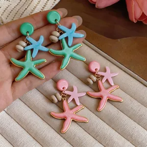 Pendientes de botón estrella de mar de resina con borde dorado para vacaciones en playa