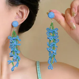 Blue beaded tassel earrings for women with vacation style, close-up showing fine details.