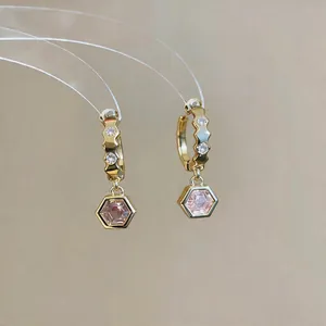 Detailed view of elegant gold hoop earrings with hexagonal pink zircon pendants for women