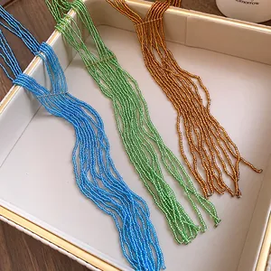 Close-up detail of multi-color crystal beaded tassel necklaces in ethno-style design