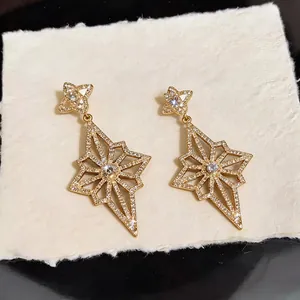 Luxurious 14K gold plated diamond-encrusted star-shaped drop earrings for women