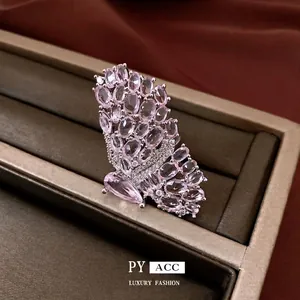 Elegant pink butterfly open ring featuring micro-pave crystals in a vintage luxury style.