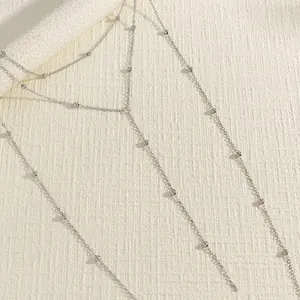 Elegant silver beaded double-layer body chain accessory for bikini and beach wear.