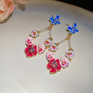 Vintage floral drop earrings with elegant pearls and colorful enamel flower motifs