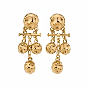 Vintage gold hammered drop earrings with textured pleated metal dangling elements.