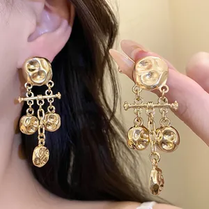 Vintage gold hammered metal pleated pendant earrings with a luxury high-end design