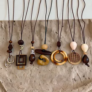 Detailed view of various Bohemian style necklaces with artistic geometric pendants