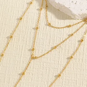 Macro shot showing the intricate details of a gold beaded double-layer body waist chain.