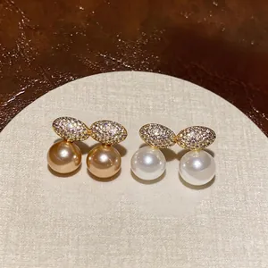Elegant French style zircon-encrusted oval pearl clip earrings for non-pierced ears.