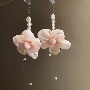 Elegant pink chiffon flower earrings with pearls and rhinestone details for women.