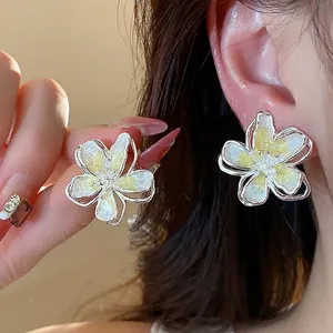 Elegant enamel flower stud earrings with minimalist floral design in silver tone