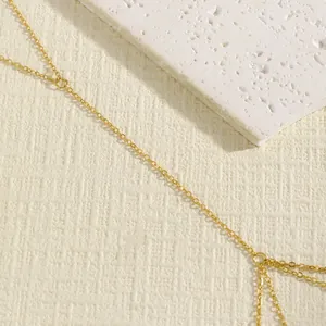 Macro detail of a vintage double-layer gold chain body jewelry with delicate links