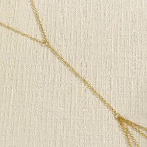 Detailed view of the delicate gold-tone metal links of a sexy retro bikini body chain