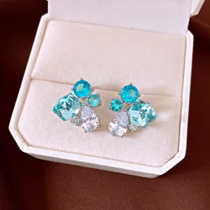 Detail view of vintage silver needle zircon teardrop earrings displayed in a jewelry box