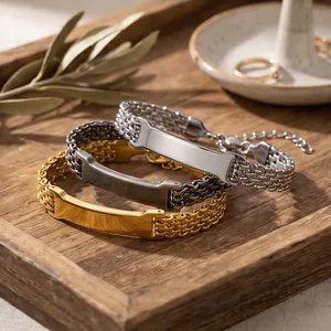 Detail showing three colors of mesh stainless steel bracelets with blank engravable plates