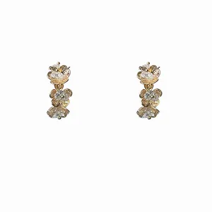 Elegant silver needle zircon pleated flower C-shaped stud earrings on white background