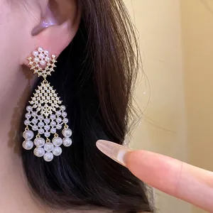 Elegant French vintage style gold dangle earrings featuring sparkling zircon and pearls