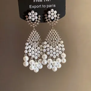 Elegant silver needle chandelier earrings with zircon and pearls in French vintage style.