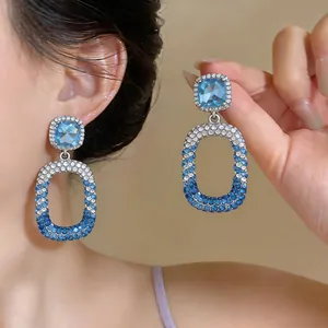 Elegant blue gradient rhinestone hollow drop earrings with silver needle studs for women