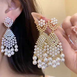 Exquisite chandelier earrings with lustrous pearls and sparkling zircons in vintage style