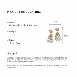 Detail view of vintage pearl drop earrings with size and material specifications