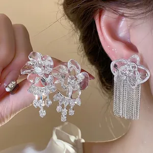 Elegant resin flower stud earrings with shimmering zircon tassel details