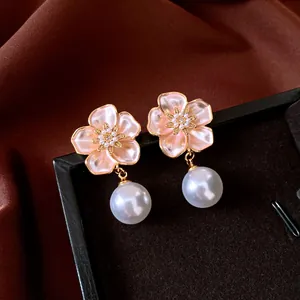 Detailed close-up of elegant pink flower pearl drop earrings in French vintage style