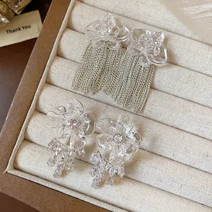 Elegant resin flower tassel earrings with zircon studs presented in jewelry box