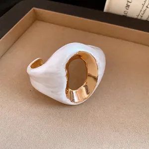 Elegant retro pleated white marbled open cuff bracelet with polished gold interior