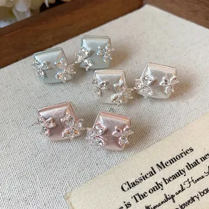 Elegant square pearl earrings with zircon flower accents in multiple pastel colors.