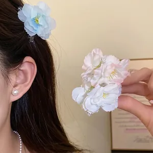 Elegant pink and blue silk flower hair clips for women with a fairy-style aesthetic
