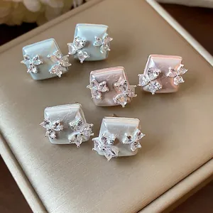 Elegant geometric flower stud earrings with zircon in blue pink and white colors