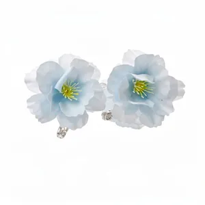 Elegant light blue fabric flower duckbill hair clips for a delicate feminine hairstyle