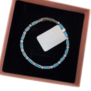 Elegant rectangular blue zircon bracelet with minimalist clasp in a premium pink gift box