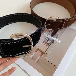 Vintage style leather belts with decorative white zigzag stitching and silver oval buckles