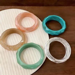 Set of colorful vintage acrylic style bangles with geometric faceted design for women