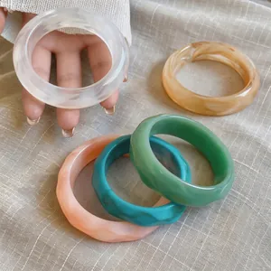 Elegant retro acrylic bangles set featuring marble patterns and solid colors for women