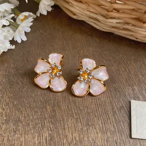 Close-up view of elegant French pearl flower earrings featuring gold-plated petals