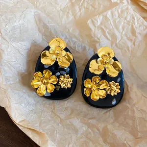 Vintage gold flower resin stud earrings in New Chinese style on wrinkled paper