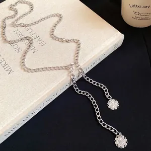 Minimalist silver chain waist belt featuring delicate circular floral pendants for women