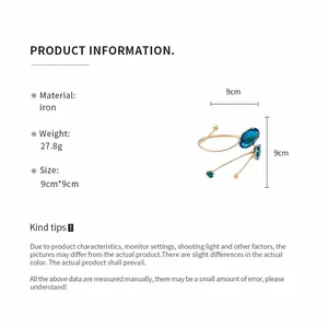 Detail view showing product dimensions, weight, and material of the blue crystal arm cuff.