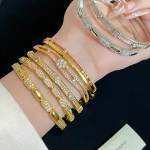 Detailed view of 18K gold plated double-layer bangles with sparkling cubic zirconia