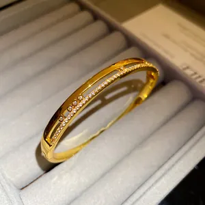 Close-up of 18K gold plated double-layer bangle with pavé zirconia settings