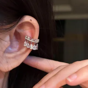 Elegant silver ear cuff with dangling teardrop zircon stones, perfect for non-pierced ears
