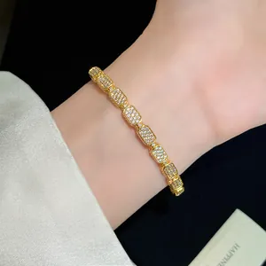 Detailed view of 18K gold plated bracelet with pave-set rectangular cubic zirconia stones