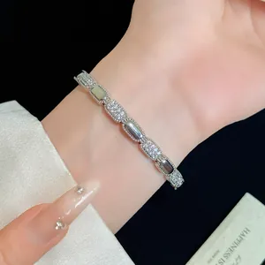 Elegant 18K silver plated bracelet with oval zircon links on woman's wrist