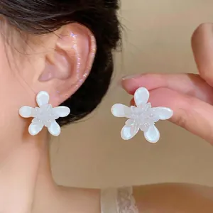 Elegant white flower stud earrings with silver needles and pearl-like finish for women