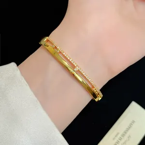 Elegant 18K gold-plated double-layer bangle bracelet with sparkling white zircons