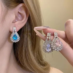 Elegant teardrop rhinestone dangle earrings with sparkling blue and pink faceted stones